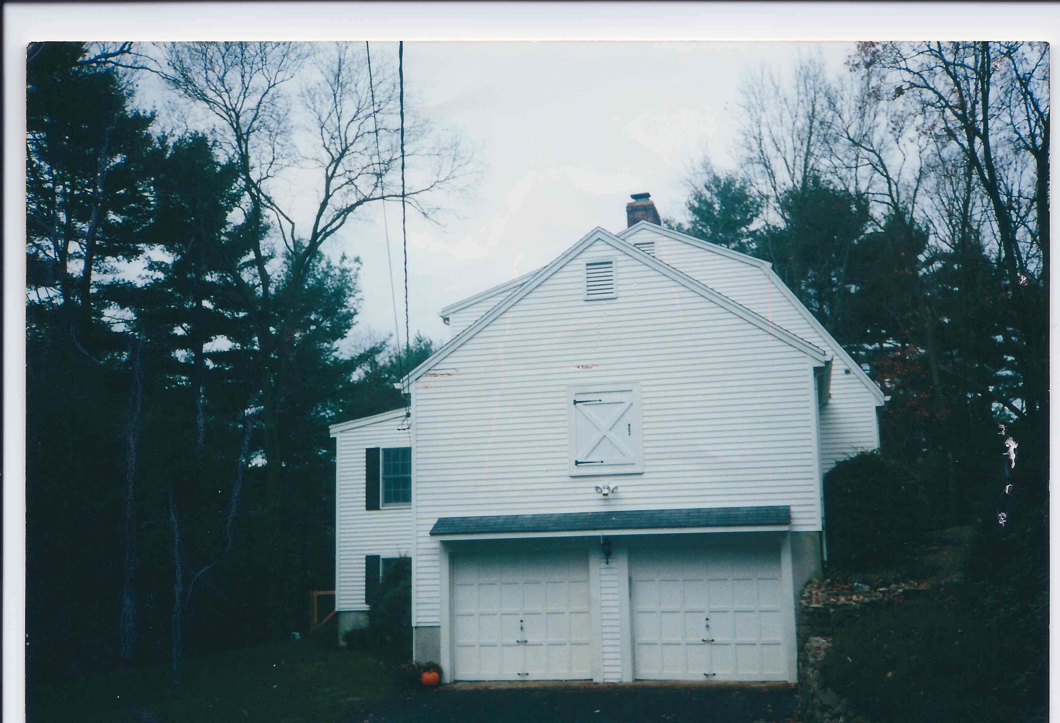 BEFORE - A Country Garrison with a 2 car garage.