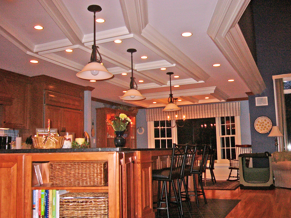 Kitchen in Dover, MA . Dropdown and recessed lighting, fancy ceiling, cherry cabinets, black counter