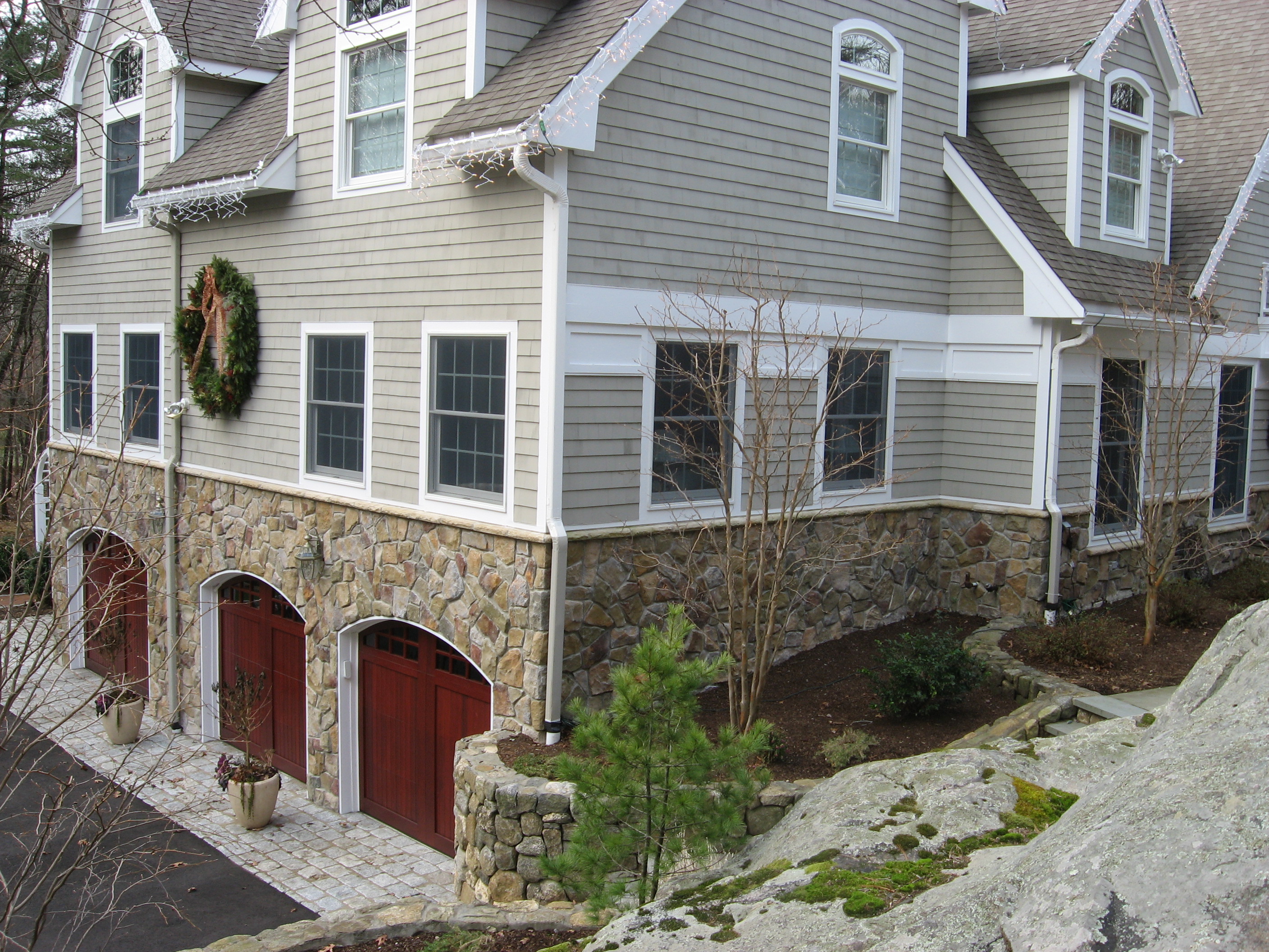 corner view with 3 car garage