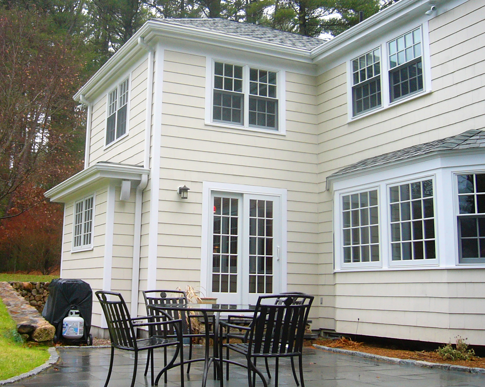 view of back of house with a deck